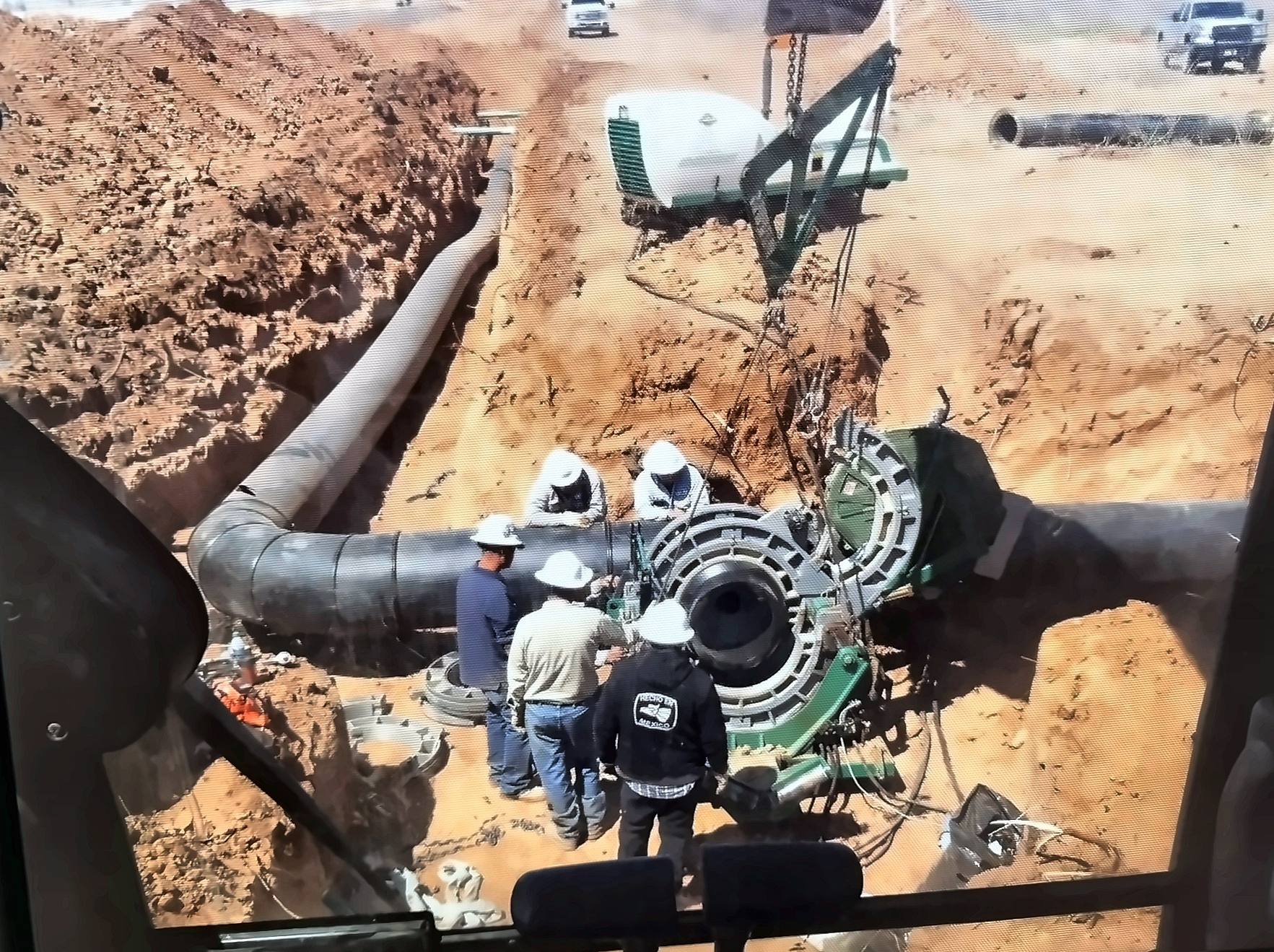 Encore crew making up a flanged connection on large-diameter steel pipe